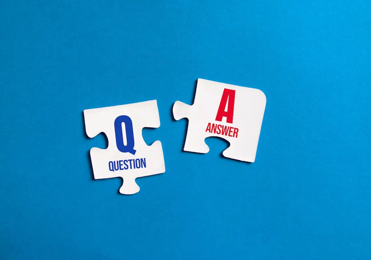 Up close image of puzzle pieces representing questions and answer